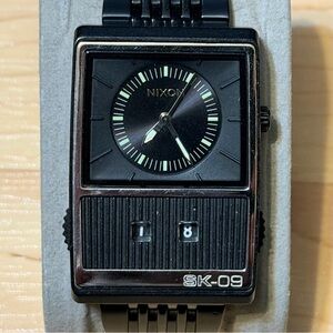 Nixon The Score SK-09 "To Revert" Black Metal Counter Men's Analog Watch RUNS